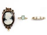 three pieces of jewelry including a ring, a ring, and a broochle
