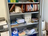 a metal cabinet with many files and folders on it