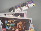 a person holding a video game in their hand