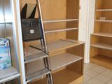 a ladder that is leaning against a wall in a room