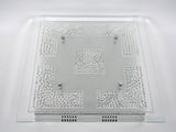 clear glass plate with a square design on it