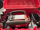 a red tool box with tools inside of it