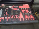 many tools in a case that are sitting on the floor