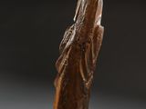 an old wooden statue of a woman with a veil on her head