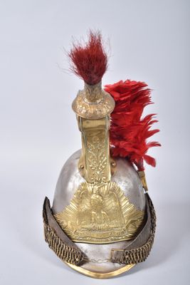 helmet of a soldier with a red feather on top of it