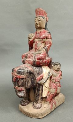 an image of a statue of a woman sitting on a horse