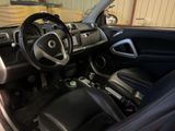 the interior of a car with a steering wheel, dashboard and dashboard controls