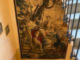 a picture of a painting on the wall above the stairs