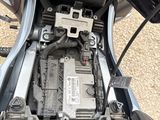 a close up view of a motorcycle engine with its cover open