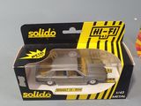 a toy car that is in a box on a table