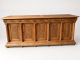 an image of a wooden chest with carvings on the front