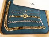 a tray that has a bunch of different bracelets on it