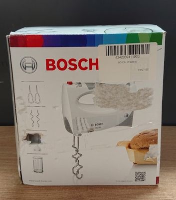 Mixeur plongeant Bosch dans son emballage, posé sur une table en bois avec un arrière-plan multicolore
