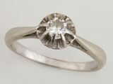 a close up of a diamond ring on a white background
