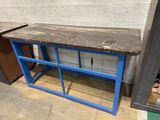 an image of a blue table with a black top in a room