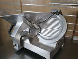 an image of a meat slicer sitting on a counter
