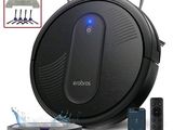 un gros plan d'un aspirateur robot équipé d'une télécommande
