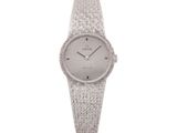 a close up of a watch on a white background with a white background
