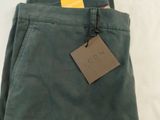 the pants are green and have a tag on them