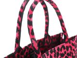 pink and black leopard print tote bag on a white background