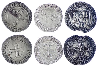 six types différents de pièces d'argent sur fond blanc