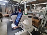 a machine that is sitting on a table in a warehouse