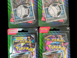 three packs of pokemon trading cards are in the packaging