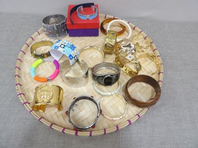 a tray with a variety of rings and bracelets on it