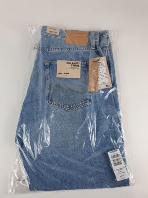 a close up of a pair of blue jeans wrapped in plastic