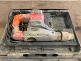 a tool in a case that is sitting on the floor