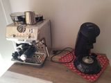 a coffee machine and a coffee pot on a table