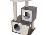 a cat tree with a cat bed on top of it