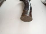 a close up of a hammer and some other tools on a table