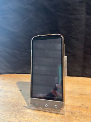 an image of a cell phone sitting on top of a wooden table