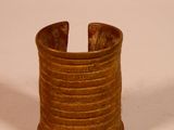 an image of a wooden cuff bracelet on a white surface