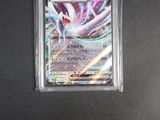 a close up of a pokemon card in a plastic case