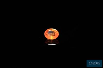 an orange moon shines in the dark sky with a black background