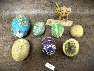 many different types of easter eggs on the table