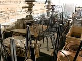 many chairs and tables in a room with a lot of pots and pans