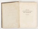 an open book on a white surface with a picture of a cat