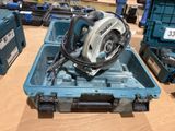 a blue tool box with a circular saw on top of it