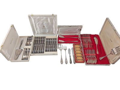 a silver case with silverware in it on a white background