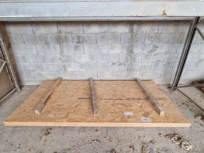 a picture of a wooden floor in a garage