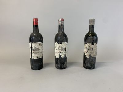 three bottles of wine sitting next to each other on a table