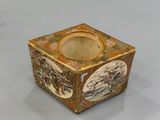 an image of a gold and white box with a picture of people on it