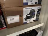 two boxes on a shelf with a computer on it