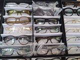 many pairs of eyeglasses in a case