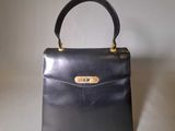 vintage black leather handbag with gold hardware