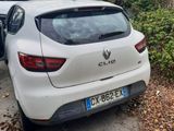a white car parked on the side of the road