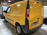 a yellow van that is parked in a garage